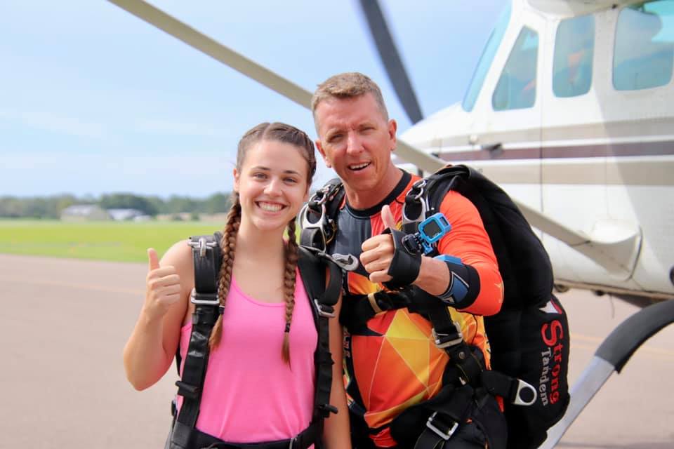 first time jumper taking skydiving pictures and videos with uspa certified tandem instructor