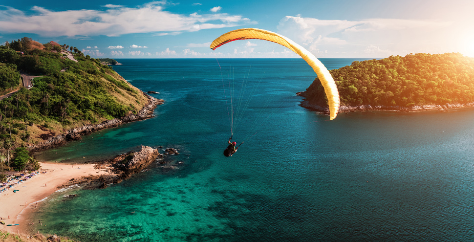 skydiving florida parachute flying over the ocean